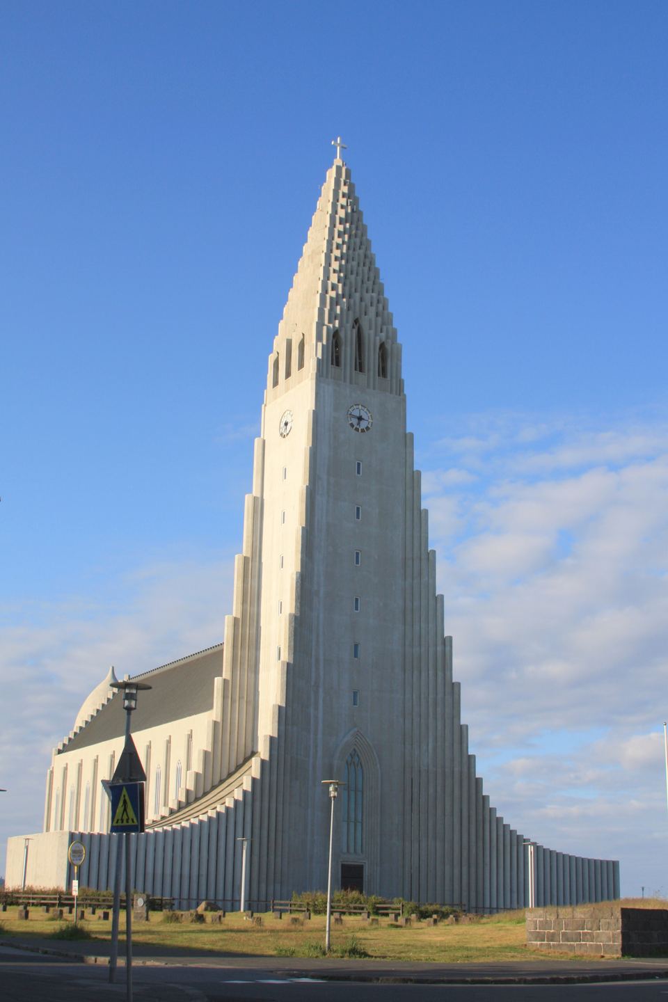 Exterior view of the iconic Hallgrímskirkja church under a blue sky in Reykjavík