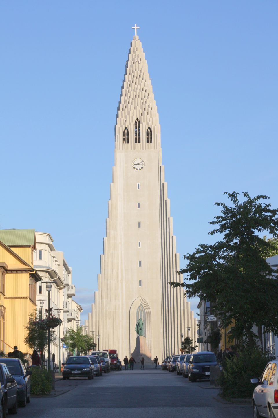View looking down a Reykjavík street toward Hallgrímskirkja church framed by buildings
