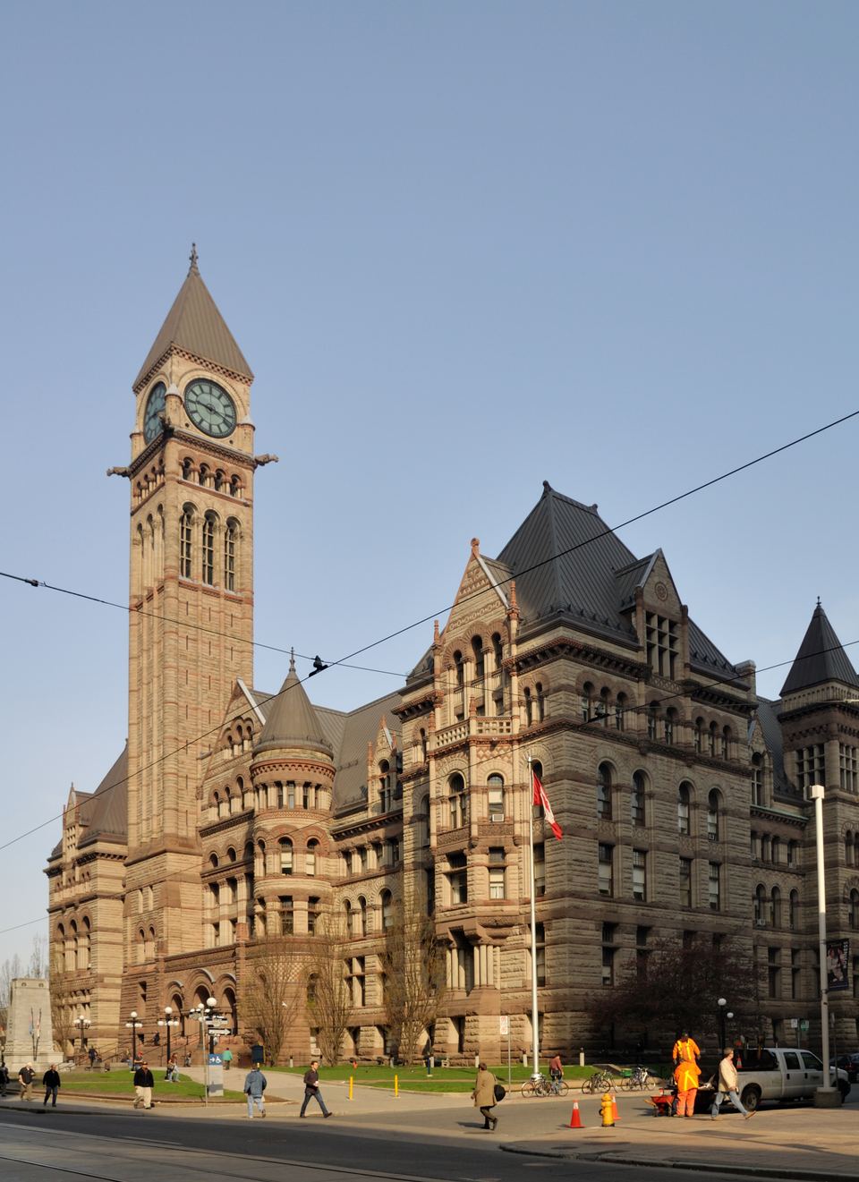 The Romanesque stone facade and clock tower of Old City Hall in Toronto