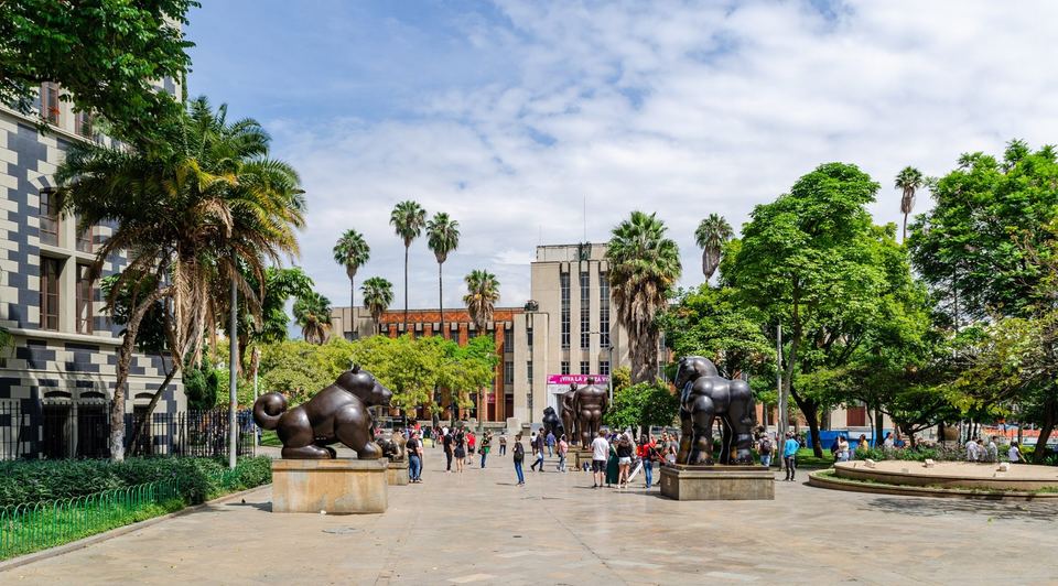 Bronze Botero sculptures on the palm-lined plaza outside the Museo de Antioquia in downtown Medellin