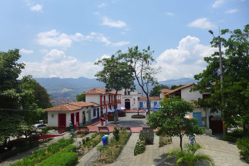 Whitewashed colonial-style houses and a cobbled lane at Pueblito Paisa on Cerro Nutibara