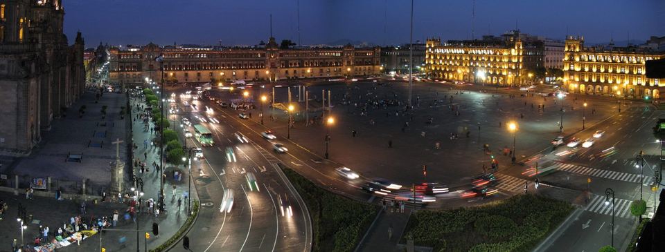 The Zocalo lit at nightfall with the cathedral and National Palace