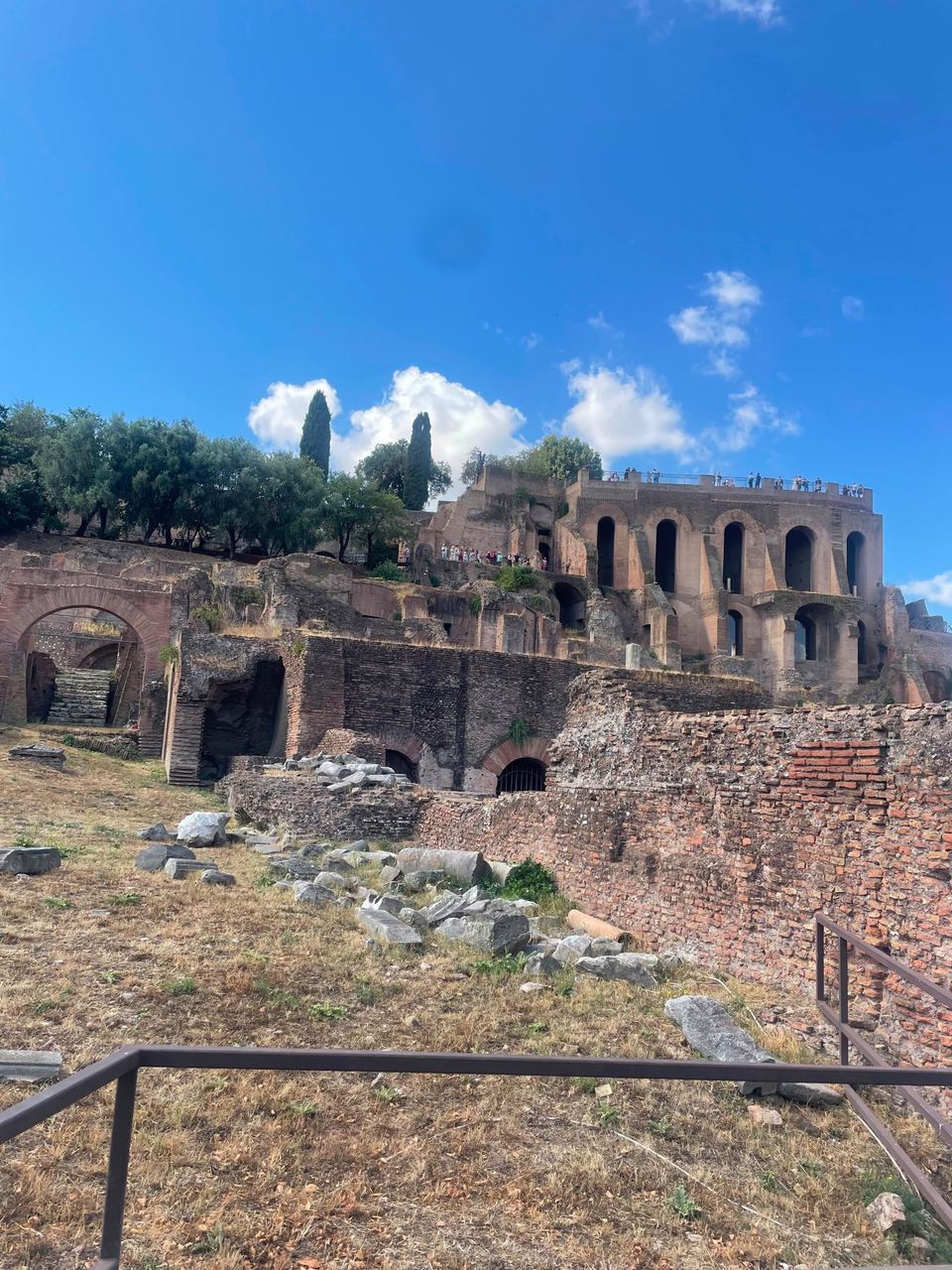 ancient Roman ruins under blue sky in Palatine Hill, Rome