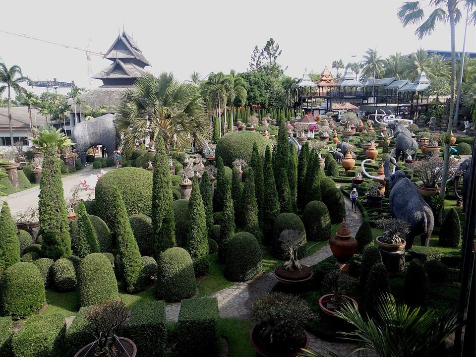 Clipped topiary, palms and pavilions in the landscaped grounds of Nong Nooch Tropical Botanical Garden